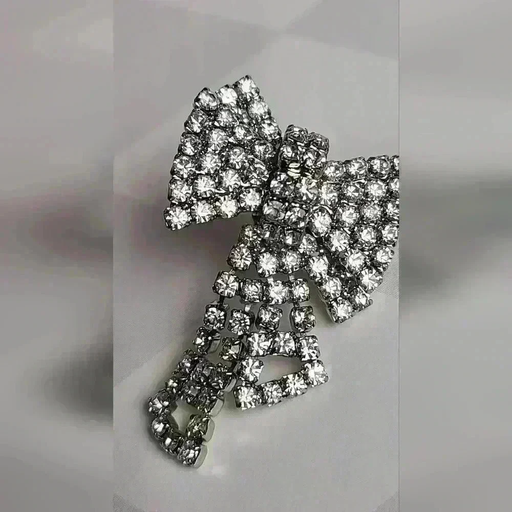 Silver tone clear rhinestones bow earrings - Picture 13 of 17